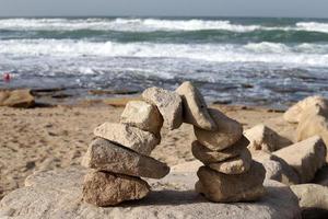 The stones lie on the shores of the Mediterranean Sea. photo