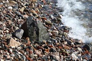 The stones lie on the shores of the Mediterranean Sea. photo