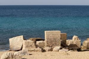 The stones lie on the shores of the Mediterranean Sea. photo