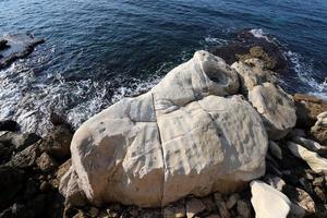 The stones lie on the shores of the Mediterranean Sea. photo