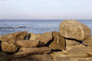 The stones lie on the shores of the Mediterranean Sea. photo