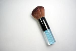 Cosmetic brush makeup isolated on white background photo