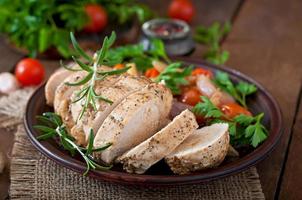 healthy dinner - healthy baked chicken breast with vegetables on a ceramic plate in a rustic style photo