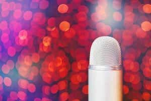 Retro microphone on stage with bokeh light background. photo