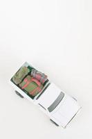 Car toy model with suitcases. photo