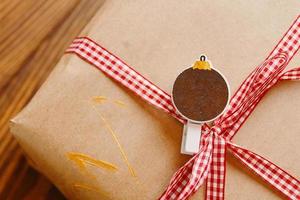 Gift box on wooden table. photo