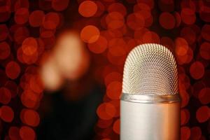 Retro microphone on stage with bokeh light background. photo