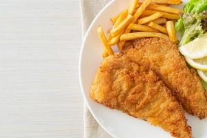 Homemade Breaded Weiner Schnitzel with Potato Chips photo