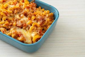 homemade macaroni bolognese with cheese photo