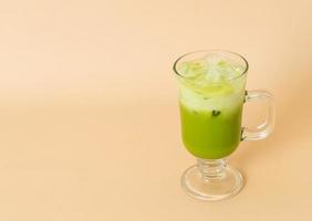 iced matcha green tea latte in glass photo