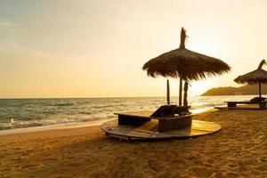 beach chair and umbrella with sea beach background photo