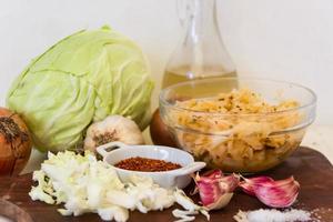 handmade preparation of sauerkraut and cabbage kimchi photo