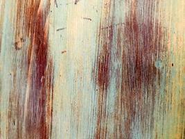 la textura de las tablas de madera de pintura natural de color abigarrado envejecido en mal estado. el fondo foto
