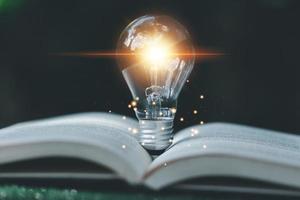 Bright light bulb and icon with book. Business success idea and education or learning online concept. Business person achievement and inspiration. technology, Create Imagination for Inspiration. photo