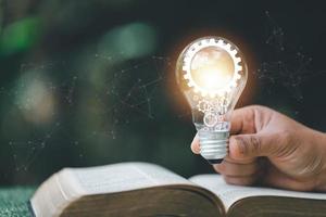 Bright light bulb and icon with book. Business success idea and education or learning online concept. Business person achievement and inspiration. technology, Create Imagination for Inspiration. photo