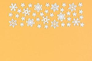 Set of white snowflakes on colorful background. Top view of Christmas ornament. New Year time concept with empty space for your design photo