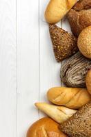assorted of bread on white wooden background photo