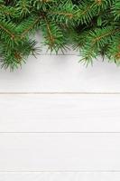 Christmas wooden background with fir tree. Top view with copy space for your text photo