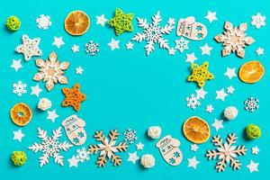 Top view of blue background with New Year toys and decorations. Christmas time concept with copy space photo