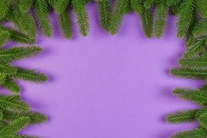 Top view of colorful background made of green fir tree branches. New year holiday concept with copy space photo