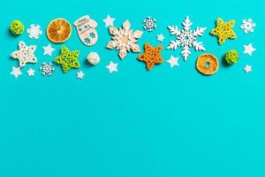 Top view of blue background with New Year toys and decorations. Christmas time concept with copy space photo