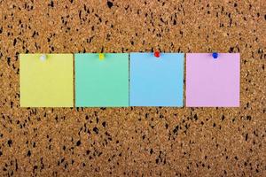 cork board with blank notes. blank notes for copy space photo