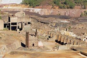 View of Mining activity in Minas de Riotinto in Spain. Apocalypse scenery. Extractivism. Mining village in Andalusia. Earth destruction. Disruption of nature. Mining industry. photo