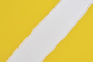 Torn ripped paper edge with a copy space, white and yellow color background photo