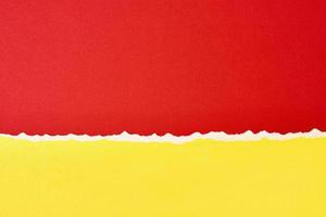 Torn ripped paper edge with a copy space, red and yellow color background photo