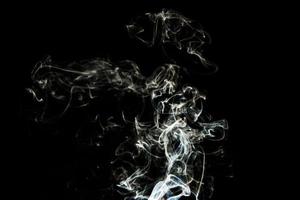 Smoke effect texture. Isolated background. Black and dark backdrop. Smokey fire and mistic effect. photo