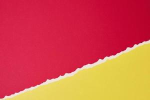 Torn ripped paper edge with a copy space, red and yellow color background photo