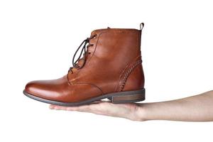 Pair of brown leather womens boots on the white background isolated photo