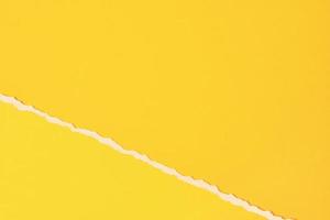 Torn ripped paper edge with a copy space, yellow color background photo