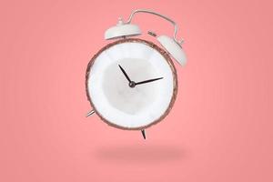 White retro alarm clock on the red background with copy space. Time concept photo