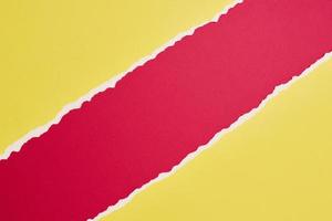 Torn ripped paper edge with a copy space, red and yellow color background photo