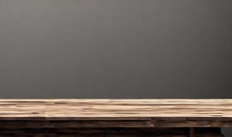 Empty wooden table in front of its background. photo