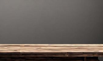 Empty wooden table in front of its background. photo