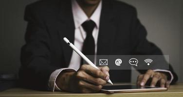 Businessman using Smart Phone with Chat message Customer support hotline .check email, call phone, address, Contact us people connection in the social world photo
