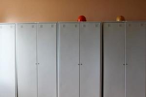 Room, locker room for workers with individual lockers for changing clothes in an industrial plant photo