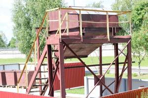 Large industrial brown waste collection bin, trash bins at an industrial plant photo