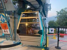 Modern beautiful cable car, lift, funicular in the mountains on vacation in a warm tropical eastern paradise country southern resort photo