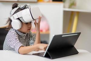 Asian girl study online with VR, virtual reality photo