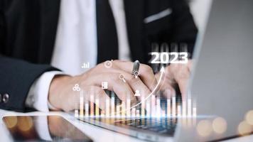 Business and Technology target set goals and achievement in 2023 new year resolution statistics graph rising revenue, planning to start up strategy, icon concept photo