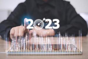 Business and Technology target set goals and achievement in 2023 new year resolution statistics graph rising revenue, planning to start up strategy, icon concept photo