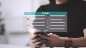 Survey form concept. Check marks on checklist and Filling online form or answering questions. Customer Experiences and satisfaction concept. photo