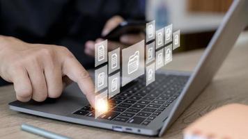Businessman with Document Management System DMS Online Document Database and automated processes in file management Search and manage document database files online. photo