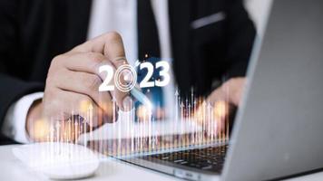 Business and Technology target set goals and achievement in 2023 new year resolution statistics graph rising revenue, planning to start up strategy, icon concept photo