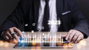 Business and Technology target set goals and achievement in 2023 new year resolution statistics graph rising revenue, planning to start up strategy, icon concept photo