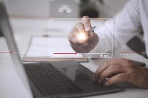 man using mouse and keyboard for streaming online, watching video on internet, live concert, show or tutorial photo