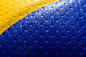 Yellow-blue uneven leather texture. Background. Abstract. Macro. photo